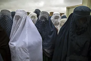 Afghan women wait to cast their ballots at a polling station in Mazar-i-Sharif Afghan women wait to cast their ballots at a polling station in Mazar-i-Sharif