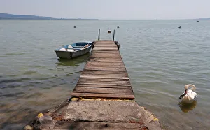 Boat is seen tied to a jetty on Lake Balaton in Keszthely Boat is seen tied to a jetty on Lake Balaton in Keszthely