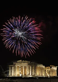 Fireworks explode over the temple of the Parthenon during New Years day celebrations in Fireworks explode over the temple of the Parthenon during New Years day celebrations in