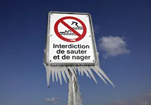 Ice is pictured on a a warning sign at the harbour of Versoix near Geneva Ice is pictured on a a warning sign at the harbour of Versoix near Geneva