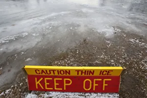A thin ice warning is posted at White's Pond in Concord, New Hampshire A thin ice warning is posted at White's Pond in Concord, New Hampshire