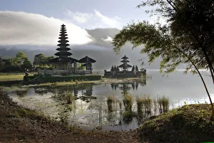 The morning sun illuminates Pura Ulun Danu Bratan, a 17th century Buddhist-Hindu temple The morning sun illuminates Pura Ulun Danu Bratan, a 17th century Buddhist-Hindu temple
