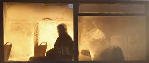 Passenger is seen silhouetted through a frosted bus window Passenger is seen silhouetted through a frosted bus window