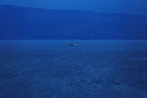 A rescue boat is seen at a location of a ferry that sank earlier this week in Lake Toba A rescue boat is seen at a location of a ferry that sank earlier this week in Lake Toba