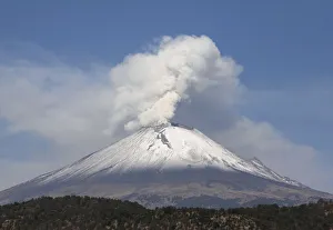 The snow-covered Popocatepetl volcano spews a cloud of steam high into the air in Puebla The snow-covered Popocatepetl volcano spews a cloud of steam high into the air in Puebla