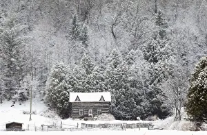 Snow covers a log cabin off Highway 36 in the City of Kawartha Lakes in central Ontario Snow covers a log cabin off Highway 36 in the City of Kawartha Lakes in central Ontario