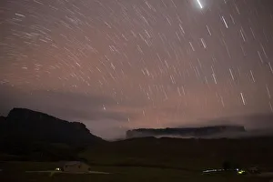 Stars are seen in the night sky over Kukenan and Roraima mounts near the Tec Camp Stars are seen in the night sky over Kukenan and Roraima mounts near the Tec Camp