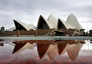 Sydney's landmark Opera House is reflected in a pool of rain water March 31, 2005 Sydney's landmark Opera House is reflected in a pool of rain water March 31, 2005