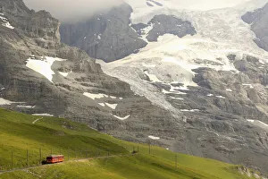 Tourists leave a train of the Jungfraubahn railways at the Kleine Scheidegg station Tourists leave a train of the Jungfraubahn railways at the Kleine Scheidegg station