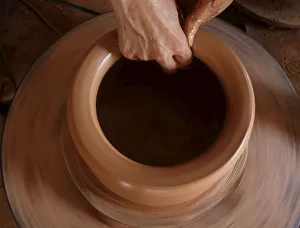 Woman makes a clay pot at a factory at Phu Lang pottery village in Bac Ninh province Woman makes a clay pot at a factory at Phu Lang pottery village in Bac Ninh province