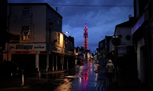 A woman walks down a side road towards the Tower in Blackpool A woman walks down a side road towards the Tower in Blackpool