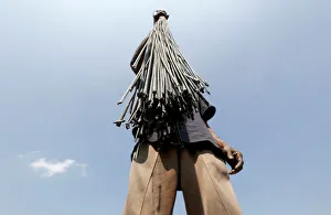 A worker holds wicks to dry at a factory ahead of Diwali, the Hindu festival of lights A worker holds wicks to dry at a factory ahead of Diwali, the Hindu festival of lights