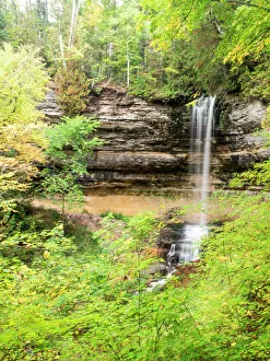 North America, USA, Michigan, Upper Peninsula. Munising Falls framed by hardwood forest North America, USA, Michigan, Upper Peninsula. Munising Falls framed by hardwood forest