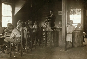 Children attending school in the morning before going to the textile mill to work in the Children attending school in the morning before going to the textile mill to work in the