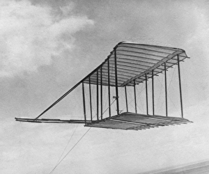 Glider invented by Orville and Wilbur Wright, being flown as a kite in Kitty Hawk Glider invented by Orville and Wilbur Wright, being flown as a kite in Kitty Hawk
