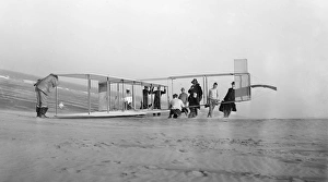 Glider being prepared for flight by Orville and his assistants with a number of Glider being prepared for flight by Orville and his assistants with a number of