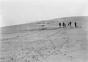 The Wright brothers' flying machine at the launching track at Big Kill Devil Hill in The Wright brothers' flying machine at the launching track at Big Kill Devil Hill in