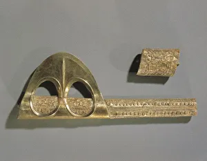 Gold axe decorated with geometric patterns and relief depicting Enkidu and Gilgamesh Gold axe decorated with geometric patterns and relief depicting Enkidu and Gilgamesh