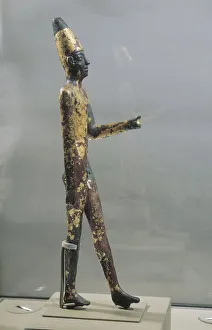 Gold-plated bronze statuette of male figure walking, from Byblos, Temple of Obelisks Gold-plated bronze statuette of male figure walking, from Byblos, Temple of Obelisks