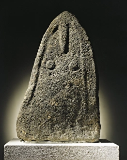 Menhir with female features from archaeological site of Genna Arrele in the surroundings Menhir with female features from archaeological site of Genna Arrele in the surroundings