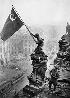 Red army soldiers raising the soviet flag over the reichstag in berlin, germany, april 30 Red army soldiers raising the soviet flag over the reichstag in berlin, germany, april 30