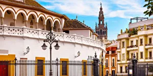 Bullring Stadium and Giralda Spire Bell Tower of Seville Cathedral, Seville, Andalusia Bullring Stadium and Giralda Spire Bell Tower of Seville Cathedral, Seville, Andalusia