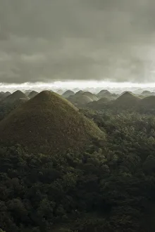Chocolate hills landscape from Bohol Island, a big storm covers the sky making an Chocolate hills landscape from Bohol Island, a big storm covers the sky making an