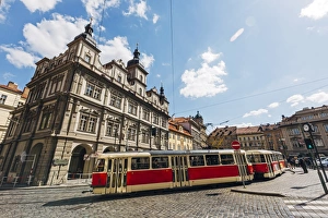 Classic red tram on the streets of Lesser town (Mala Strana) in Prague, Czech Republic Classic red tram on the streets of Lesser town (Mala Strana) in Prague, Czech Republic