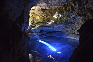 The colorful cave Poco Encantado with rays of light, Chapada Diamantina Mountains, Bahia The colorful cave Poco Encantado with rays of light, Chapada Diamantina Mountains, Bahia