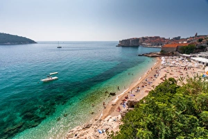 Dubrovnik, Croatia. Beach view with city in background Dubrovnik, Croatia. Beach view with city in background