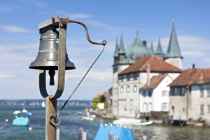 Harbour bell, port of Steckborn with Schloss Steckborn castle at back, Lake Constance Harbour bell, port of Steckborn with Schloss Steckborn castle at back, Lake Constance
