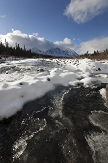 Ice, snow and water at freezing Quill Creek, St. Elias Mountains, Kluane Range behind Ice, snow and water at freezing Quill Creek, St. Elias Mountains, Kluane Range behind