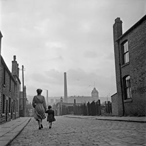 Lancashire Mill Town; Cotton mill worker Alice Nelson sets out for work at the Lilac Mill Lancashire Mill Town; Cotton mill worker Alice Nelson sets out for work at the Lilac Mill
