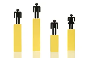 Three male figures and one female figure standing on different coloured columns of Three male figures and one female figure standing on different coloured columns of