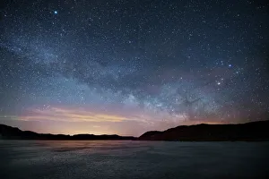 Milky Way floats above frozen lake, Front Range, Colorado, USA Milky Way floats above frozen lake, Front Range, Colorado, USA