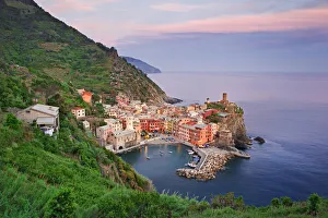 Oceanside town at sunset, Vernazza, Italy Oceanside town at sunset, Vernazza, Italy