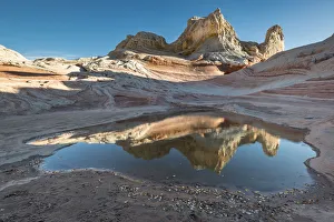 Pool reflection and sandstone landscape, Vermillion Cliffs, White Pocket wilderness Pool reflection and sandstone landscape, Vermillion Cliffs, White Pocket wilderness