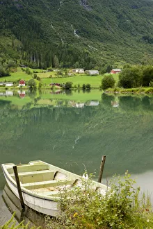 Rural scene with rowboat on lake, Olden, Norway Rural scene with rowboat on lake, Olden, Norway