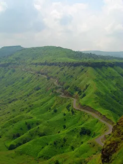 <b class=qtipBold><figcaption>Sajjangad</figcaption></b><br>Road cutting through Sahyadri mountain range near Sajjangad. Sajjangad