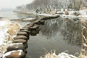 Snowscape of a stone path on the West Lake in Maojiabu village, Hangzhou, Zhejiang, China Snowscape of a stone path on the West Lake in Maojiabu village, Hangzhou, Zhejiang, China