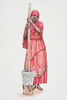 Standing African woman in traditional Somalian clothing pounding grain in a clay pot Standing African woman in traditional Somalian clothing pounding grain in a clay pot