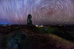 Startrails over old ruins of Buddha statues Startrails over old ruins of Buddha statues