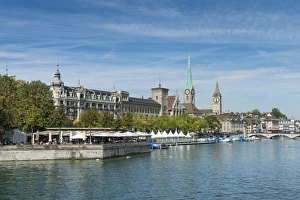 View from Quaibruecke bridge over the Limmat river, beer garden on the island auf View from Quaibruecke bridge over the Limmat river, beer garden on the island auf