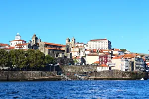 View of Ribeira district from Douro river with the Church of San Francisco and Portos Cathedral in the background View of Ribeira district from Douro river with the Church of San Francisco and Portos Cathedral in the background