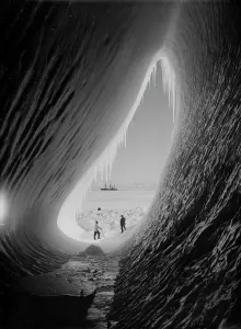 Grotto in an iceberg. Terra Nova in the distance. Taylor and Wright (Interior) Grotto in an iceberg. Terra Nova in the distance. Taylor and Wright (Interior)