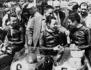 The 1st, 2nd and 3rd seen in the paddock after winning the 125 cc TT race on the Isle of Man The 1st, 2nd and 3rd seen in the paddock after winning the 125 cc TT race on the Isle of Man