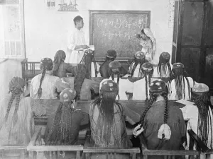 Women wearing long headdresses and plaits at a class in Tajikistan, Soviet Central Asia Women wearing long headdresses and plaits at a class in Tajikistan, Soviet Central Asia