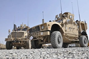 An M-ATV Mine Resistant Ambush Protected vehicle parked next to a MaxxPro MRAP An M-ATV Mine Resistant Ambush Protected vehicle parked next to a MaxxPro MRAP