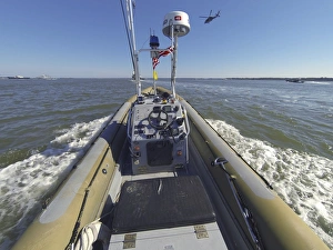 An unmanned rigid-hull inflatable boat on the James River in Newport News, Virginia An unmanned rigid-hull inflatable boat on the James River in Newport News, Virginia