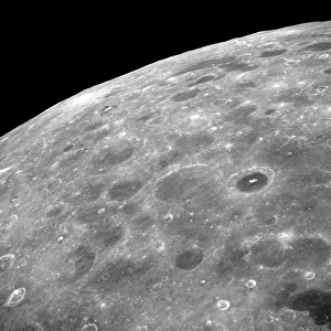 <b class=qtipBold><figcaption>View of the lunar surface</figcaption></b><br>View of the lunar surface taken from the Apollo 8 spacecraft looking southward from high altitude across the Southern Sea. Two craters are visible, the bright-rayed crater near the horizon, and the dark floored crater near the middle of the right side of the photograph.<br><em>© Stocktrek Images</em> View of the lunar surface
